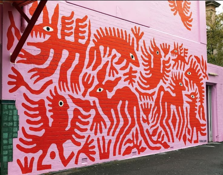 a red and white mural on the side of a building