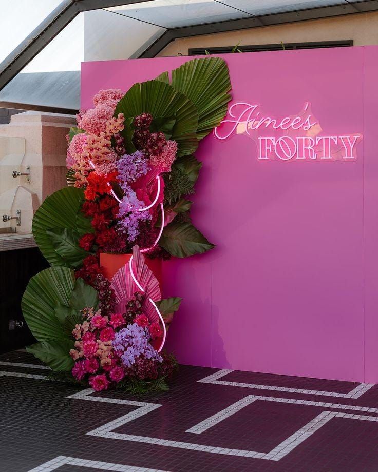 a pink sign that says jones's potty with flowers on the front and side