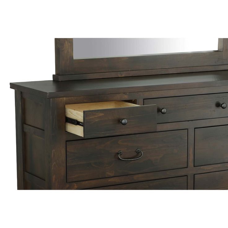 a wooden dresser with drawers and a mirror on it's top shelf, in front of a white background