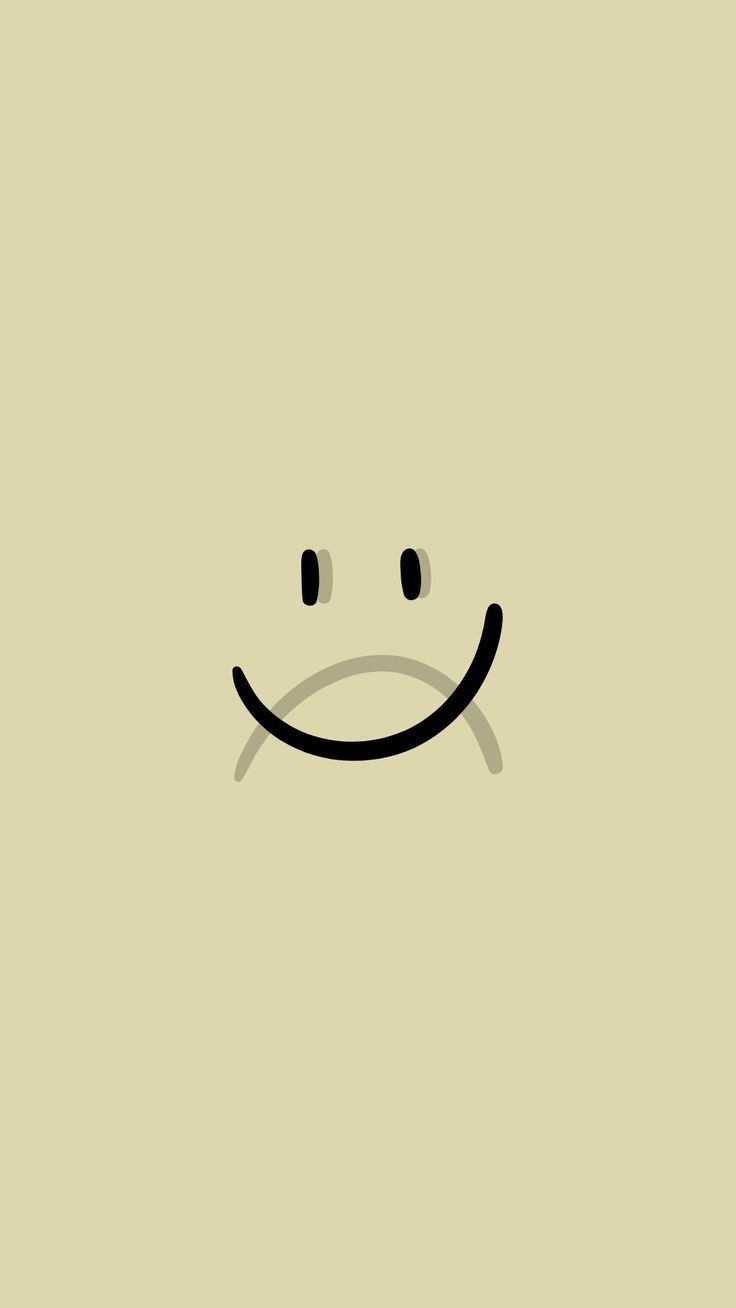 a smiley face drawn in black on a beige background