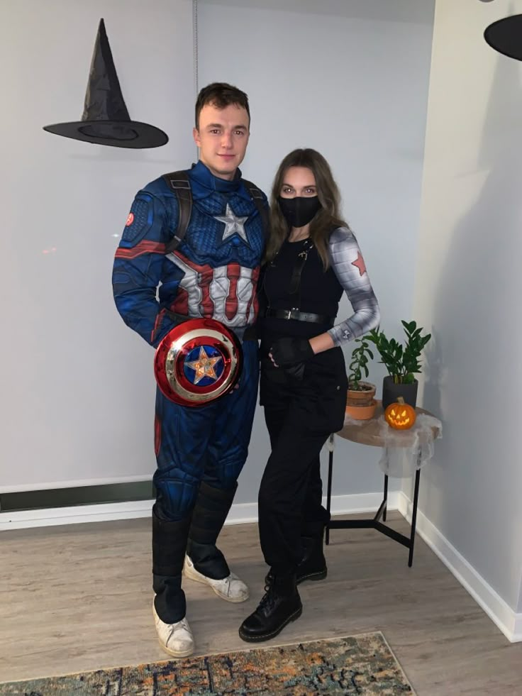 a man and woman dressed up as captain america