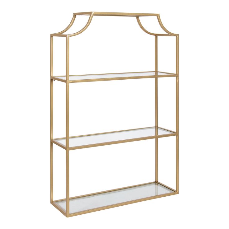 A wall shelf doesn't have to be only for storage anymore! Now your space-saving storage solutions can be a dazzling and show-stopping wall display. That's what makes the Ciel wall shelf so fabulous! It features four tiers of lovely and resilient glass shelves within a beautiful scalloped metal frame, creating a jaw-dropping display and storage solution for all your favorite keepsakes and household necessities. Its beautiful gold finish makes for a bold impression in any room of the home. The Cie Metal Floating Shelves, Decorative Shelving, Display Family Photos, Metal Wall Shelves, Wall Shelf Decor, Decorating Shelves, Modern Shelving, Space Saving Storage, Floating Shelf