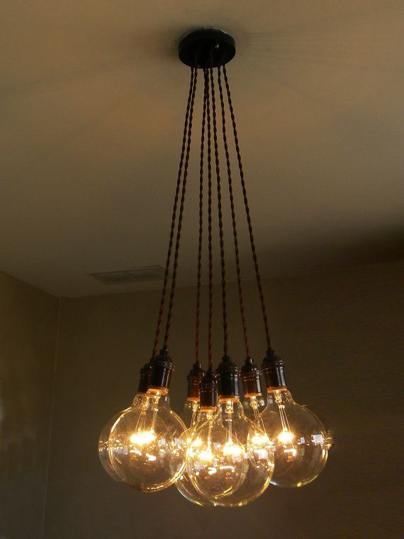 a chandelier with five light bulbs hanging from it