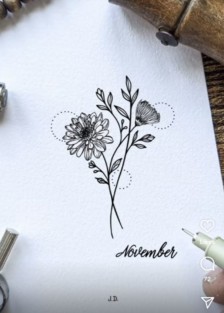 a drawing of a flower with the word november written in black ink on a piece of paper