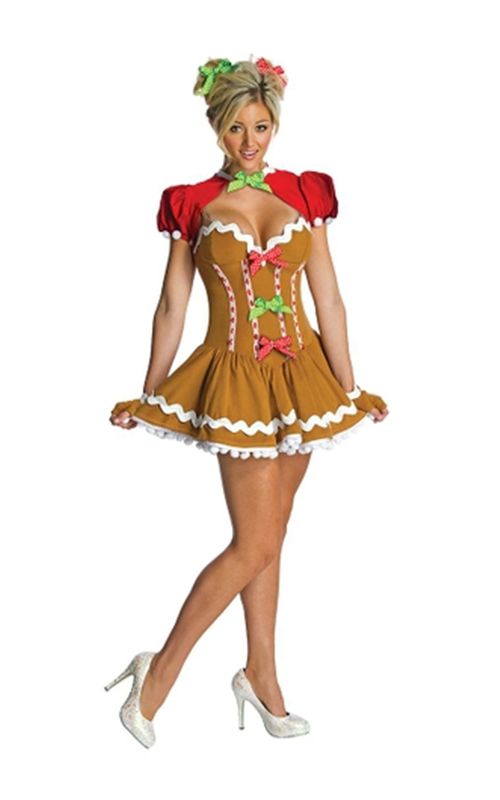 a woman dressed in a gingerbread costume posing for the camera with her hands on her hips