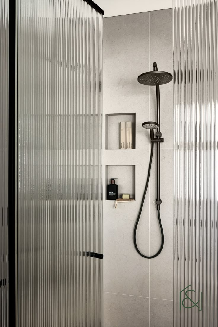 Enclosed shower with fluted glass and black frame, dark fixtures really make the space pop. Shower Over Window, Fluted Shower Door, Reeded Shower Door, Fluted Glass Window Bathroom, Glass Toilet Enclosure, Fluted Glass Bathroom, Shower Cabin Glass Design, Reeded Shower Glass Door, Fluted Glass Shower Door