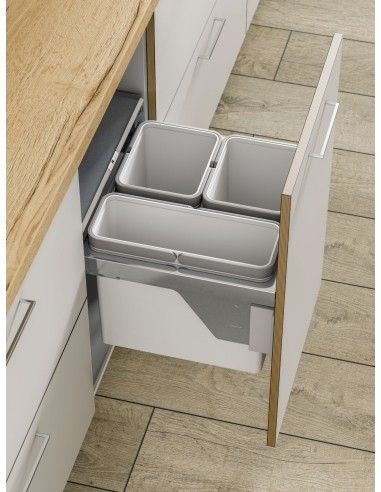 an open drawer in the middle of a kitchen