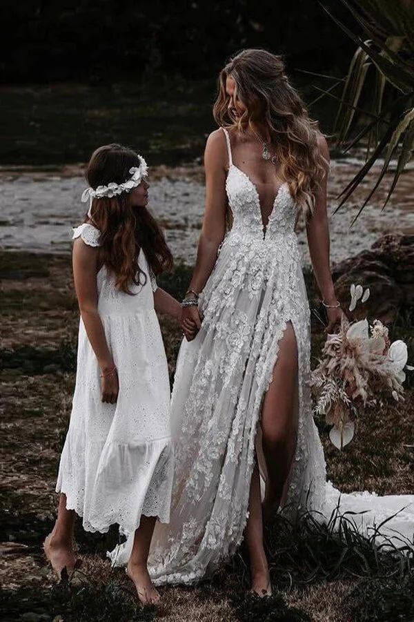 two girls in white dresses holding hands and walking together with the caption mother daughter love