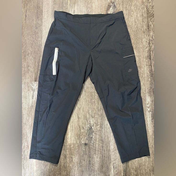 Brand New Nike Functional Bottoms With Side Pockets, Functional Nike Gym Bottoms, Nike Functional Gym Bottoms, Nike Athleisure Cargo Pants With Cargo Pockets, Nike Cargo Pants With Cargo Pockets Athleisure Style, Black Tapered Leg Activewear For Jogging, Nike Functional Cargo Pants With Side Pockets, Nike Functional Bottoms With Cargo Pockets, Nike Functional Cargo Pants With Pockets