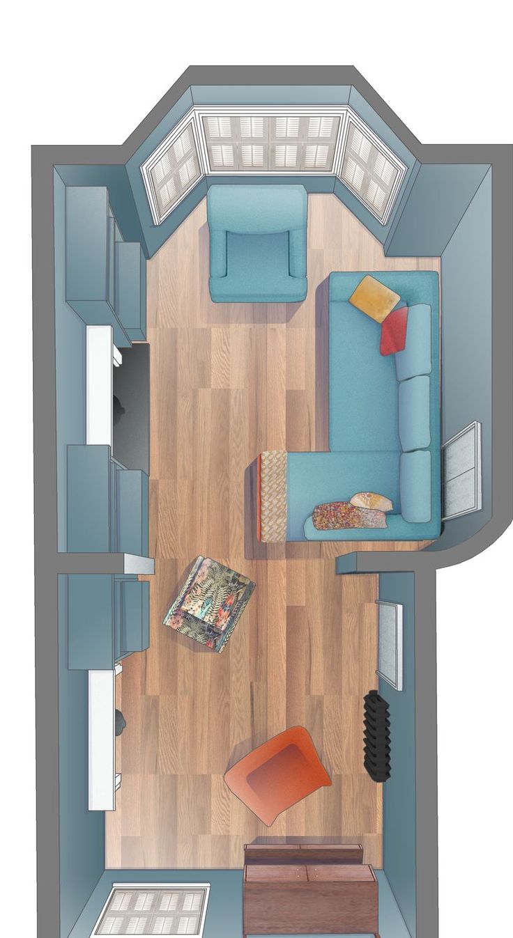 an overhead view of a small living room with blue couches and wood flooring