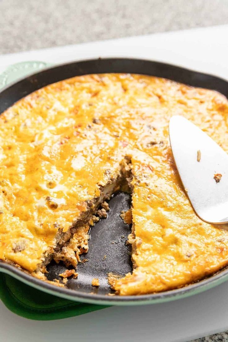 a close up of a pie in a pan with a spatula on it's side