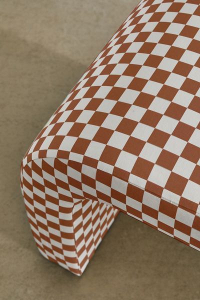 an image of a checkered table cloth on the ground with it's edges folded up