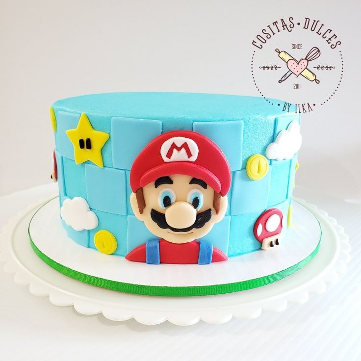 there is a cake that looks like mario's house on the top of it