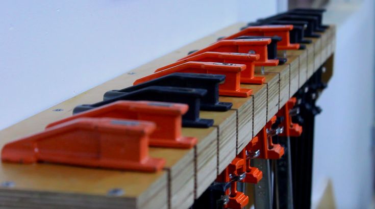 a row of orange and black pieces of wood