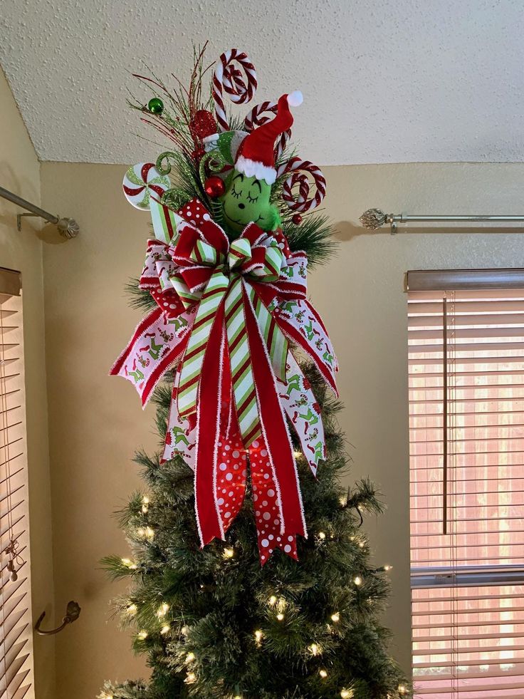 a christmas tree decorated with candy canes and bows