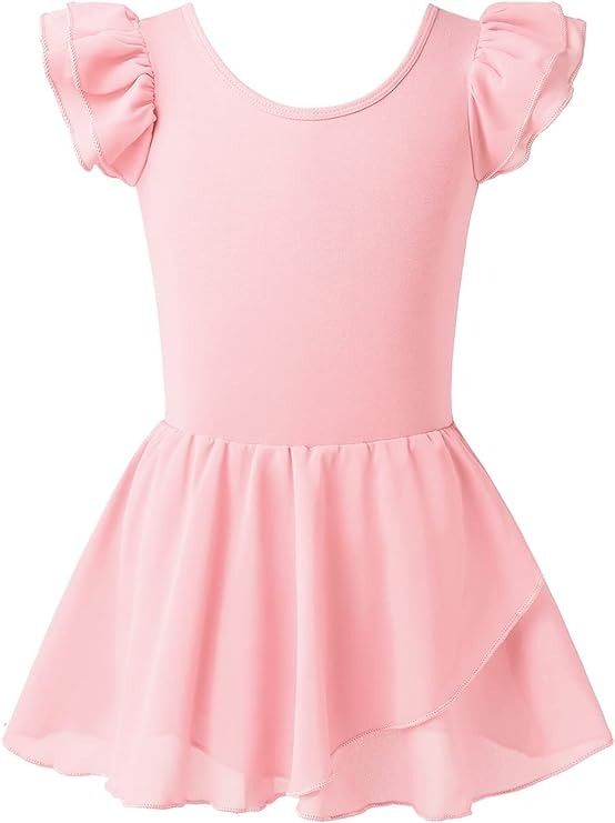 a pink dress with ruffles on the shoulders