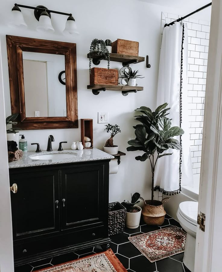 the bathroom is decorated in black and white