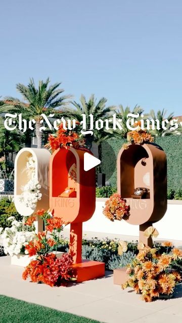 the new york times logo is displayed in front of flowers and mailboxes