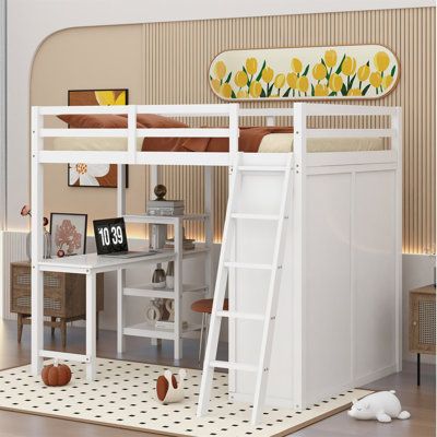 a white bunk bed with a desk underneath it and stairs to the upper level below