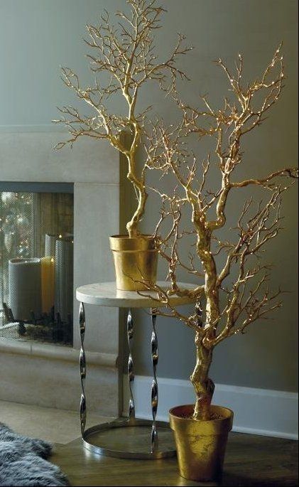 there is a gold tree in the middle of this living room, and it's very pretty