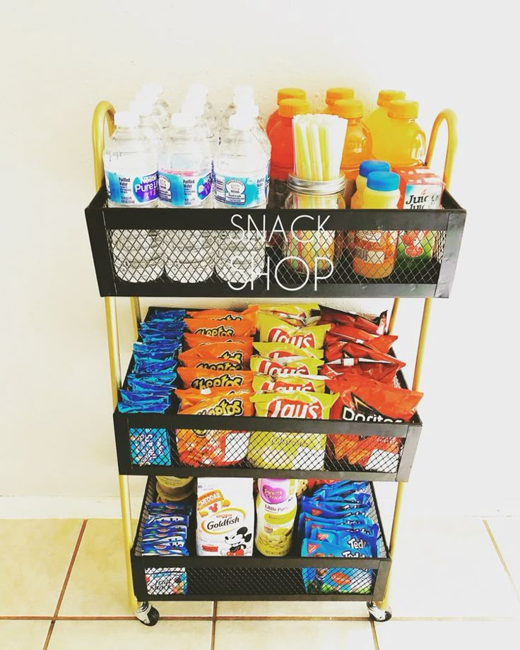 a snack stand with snacks and drinks on it