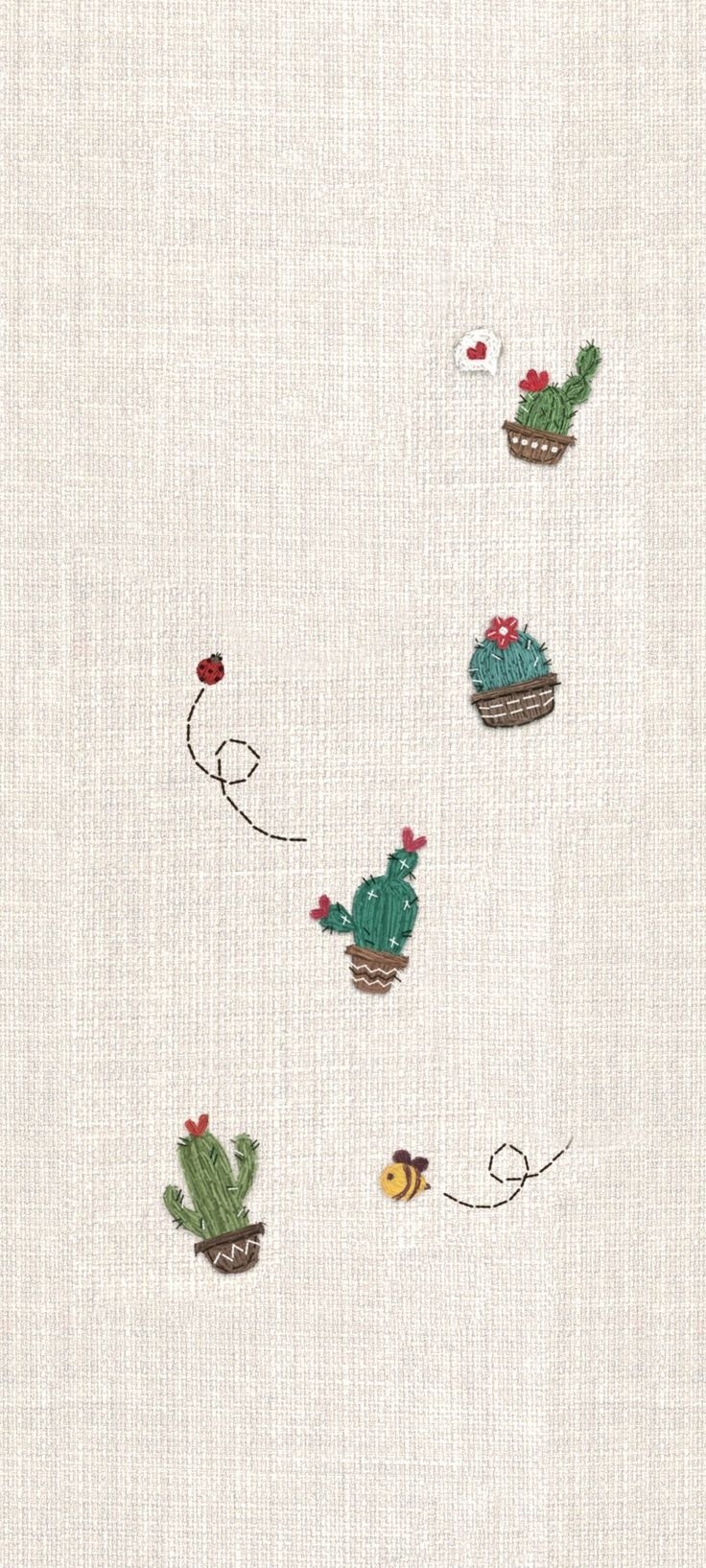 an embroidered fabric with cactus and birds on it