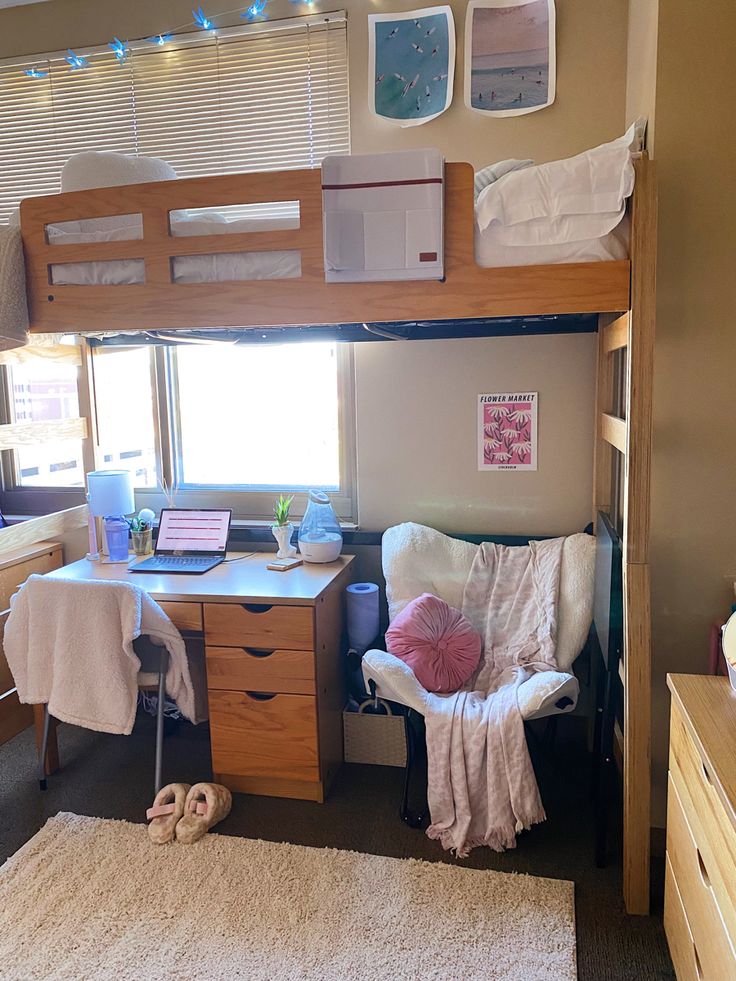 a bunk bed with desk and chair in a room that has carpet on the floor