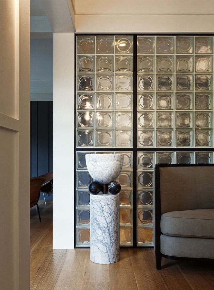 a living room filled with furniture and glass blocks