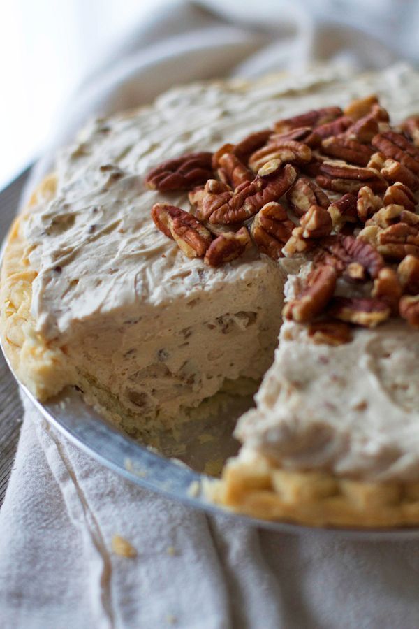 there is a pie with pecans on top