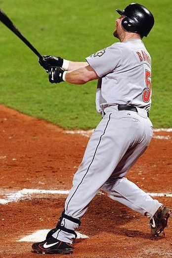 a baseball player holding a bat on top of a wooden plaque with the name jeff bagwell