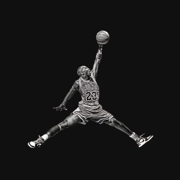 a black and white photo of a basketball player jumping up to dunk the ball