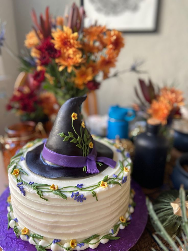 a decorated cake with a hat on top