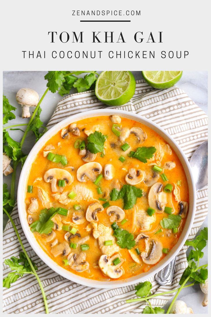 a bowl of thai coconut chicken soup with limes and cilantro on the side