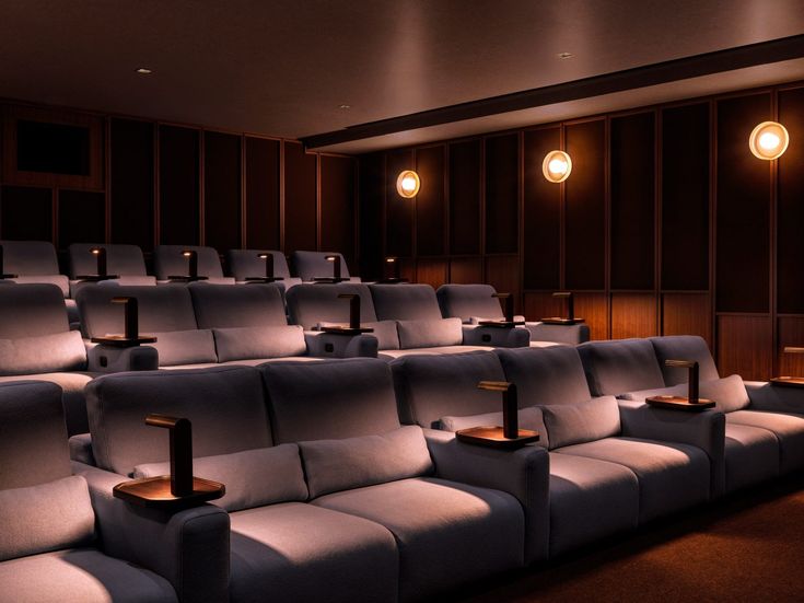 an empty movie theater with rows of seats