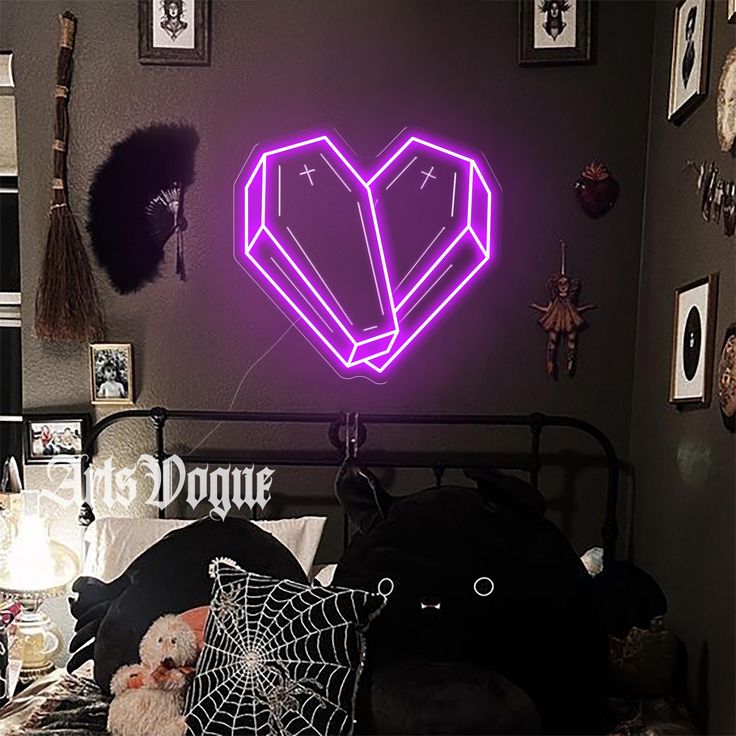 a bed room with a neatly made bed and a neon heart sign above the bed