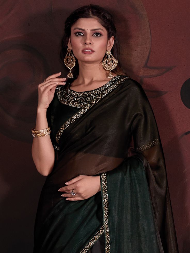 This Saree From The House Of Saree Mall Is Made From Organza And Is Dark Green In Color. Saree Mall Ethnic Sarees Comes With Blouse Piece, Which Can Be Stitched According To Your Taste And Preference. This Saree Is Crafted By Skill Craftsmen Without Compromising On Its Quality. With This Beautiful Design And Fabric, This Saree Will Fetch You Oodles Of Compliments And Praise. Saree Fit Size Is 5.5 Mtr Saree & 0.8 Mtr Blouse, Free Size |. Saree Details Saree Fabric :Organza Saree Color :Dark Green Pattern :Embellished Print :Solid Work Details :Stone Work Border :Embellished Blouse Details Blouse Fabric :Organza Blouse Color :Dark Green Blouse Print Or Pattern :Embellished Pack Contains :1 Saree 1 Blouse Size And Fit-Description :5.5 Mtr Saree & 0.8 Mtr Blouse, Free Size Occasion :Party/Wedd Dark Green Blouse, Blouse Details, Organza Blouse, Ethnic Sarees, Satin Saree, Embellished Blouse, Brown Satin, Saree Fabric, Organza Saree