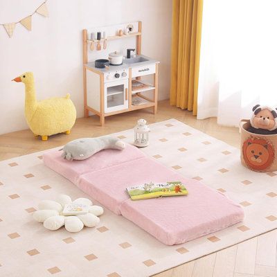 a child's play room with toys and stuffed animals on the floor in front of it