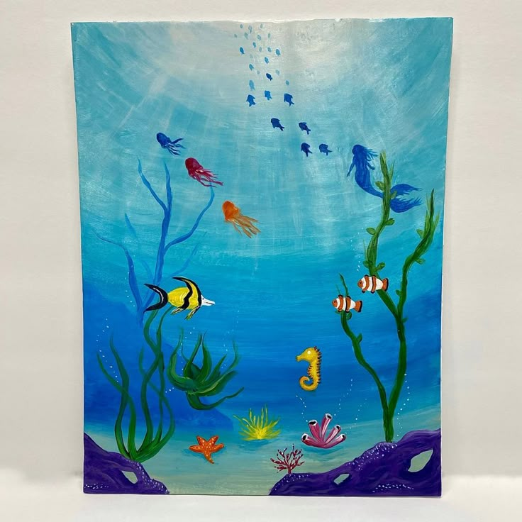 an underwater scene with fish, seaweed and corals painted on a canvas wall hanging