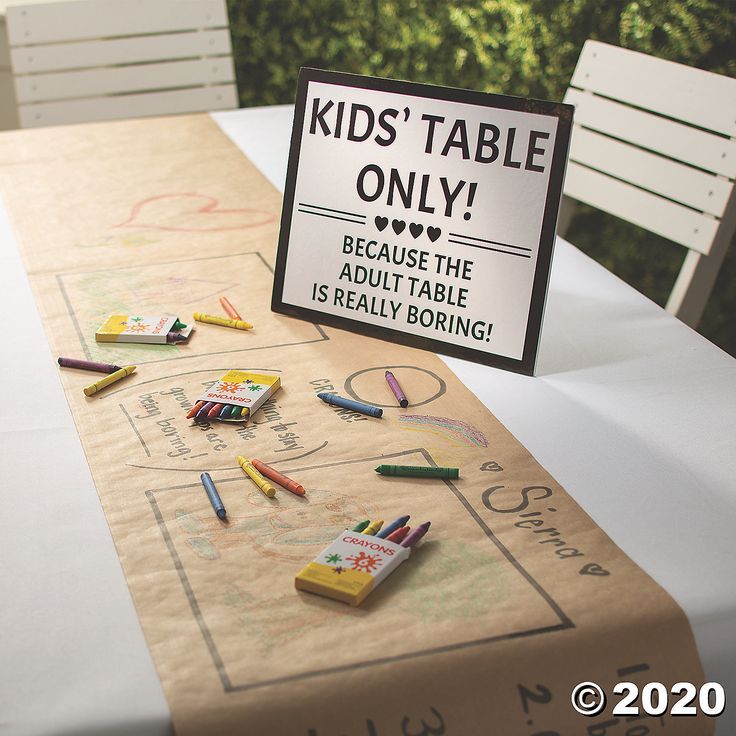 a kid's table is decorated with crayons and a sign that says kids'table only because the adult table is really boring