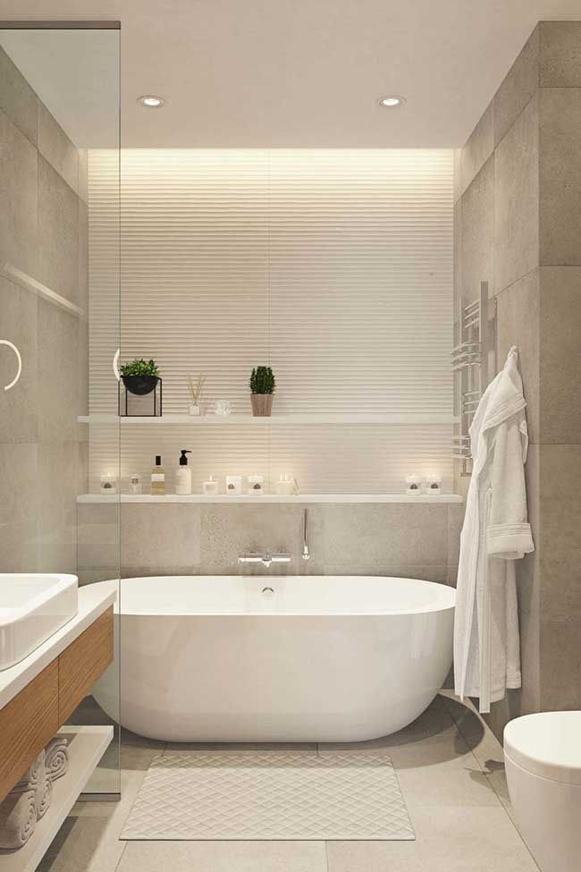 a bathroom with a bathtub, sink and toilet in the middle of the room