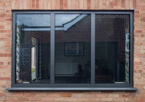 an image of a brick building with glass doors on the outside and windows in the inside