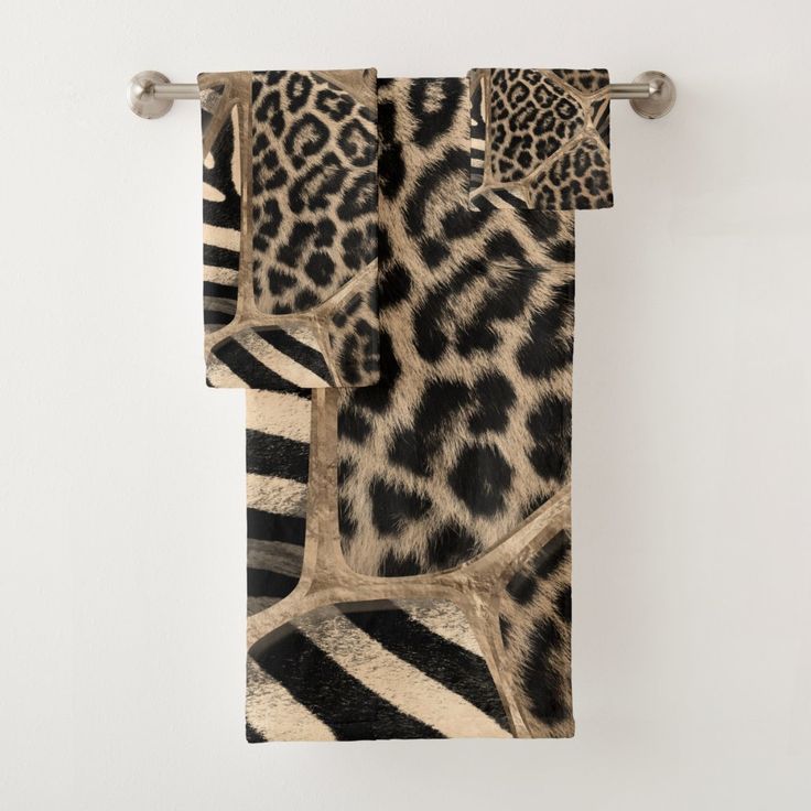 an animal print towel hanging on the wall