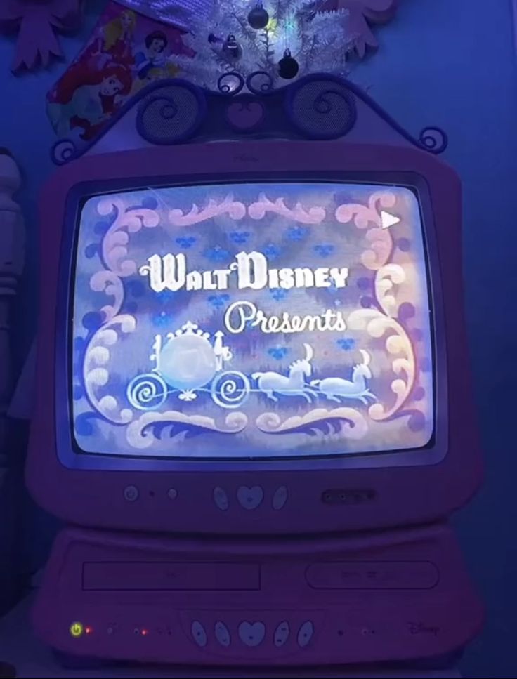 an old fashioned television with the words walt and princesses on it's screen