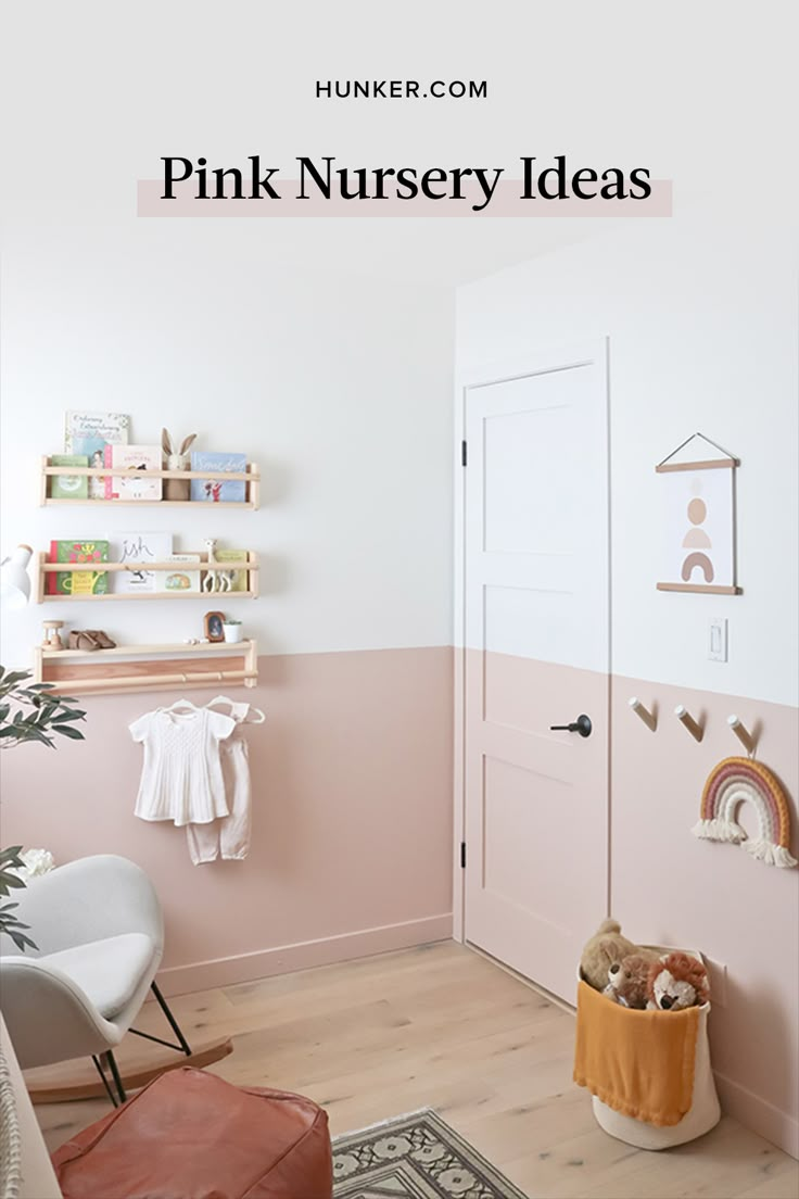 a baby's room with pink and white walls