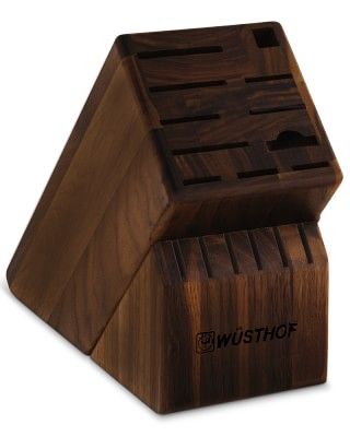 a wooden box that has some sort of knife holder on it's side, with the word wutshop written in black ink