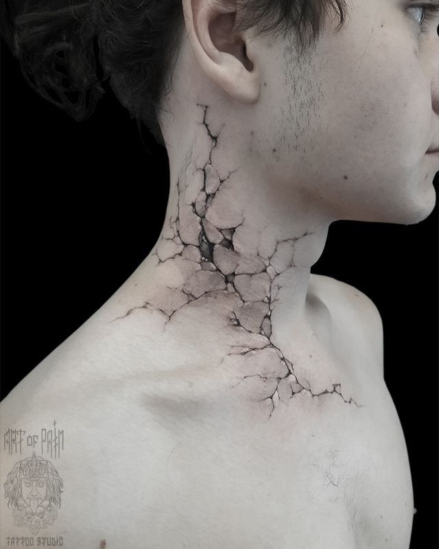 a man's neck is covered with cracks