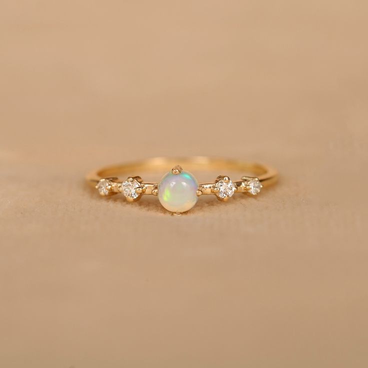 Crafted with 14k Solid Gold, this ring are not only stylish but also lightweight. You can wear this ring all day easily. Four prong set natural Ethiopian opal & diamond ring for women. Handmade jewelry, Wedding ring, Stackable ring, Anniversary ring. You can gift them on Anniversary, Birthday and Christmas. Also available in Rose Gold, White Gold and Yellow Gold. 𝐏𝐫𝐨𝐝𝐮𝐜𝐭 𝐢𝐧𝐟𝐨: 𝟏𝟒𝐤 𝐬𝐨𝐥𝐢𝐝 𝐠𝐨𝐥𝐝 ★𝐃𝐞𝐭𝐚𝐢𝐥𝐬 ★𝐒𝐊𝐔 𝐂𝐨𝐝 : 1040 ★𝐏𝐮𝐫𝐢𝐭𝐲 : Solid 14k Gold ( Also availa Opal Diamond Engagement Ring, Opal And Diamond Ring, October Birthstone Ring, Diamond Ring For Women, Opal Diamond Ring, October Birthstone Rings, Engagement Rings Opal, Man Den, Ring Minimalist