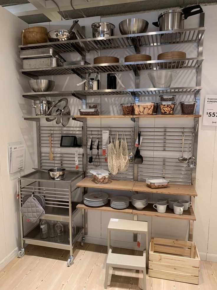 an industrial kitchen with stainless steel shelving and shelves