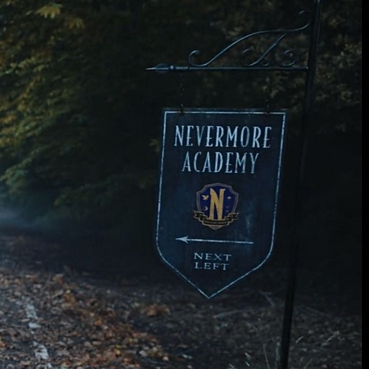 there is a sign that says nevermore academy next left