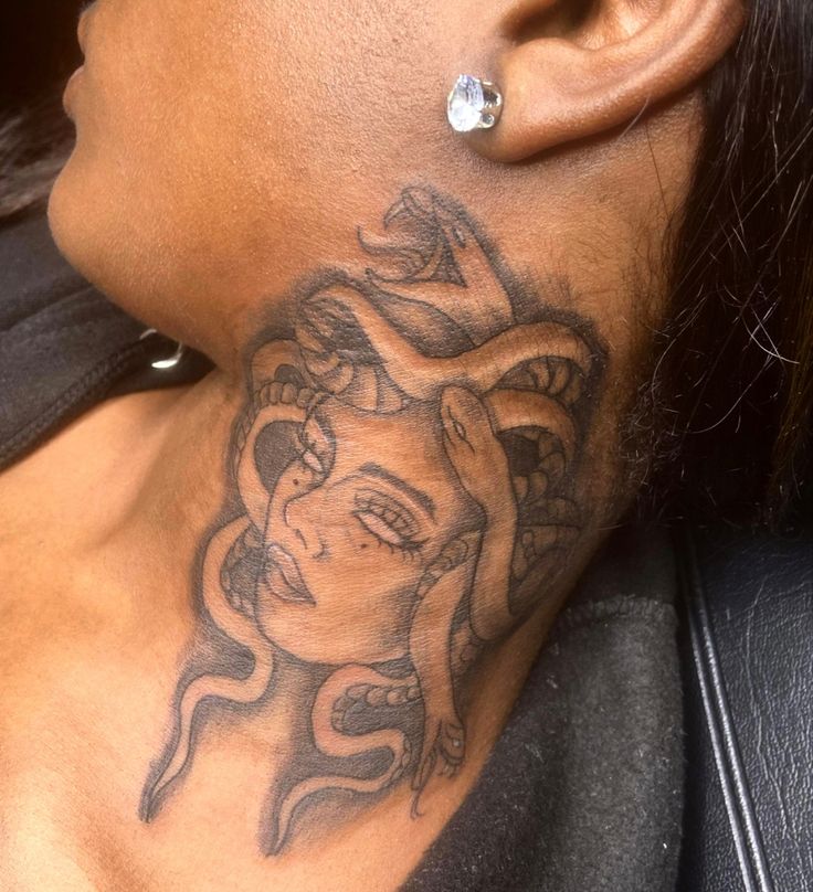 a woman with a tattoo on her neck